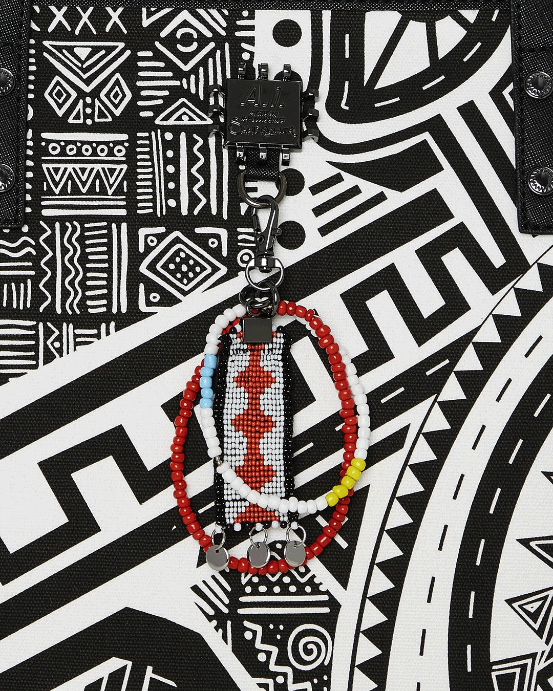 Sprayground - A.I. AFRICAN INTELLIGENCE THE SKYHAWK WING TOTE - SANDFLOWER COLLAB
