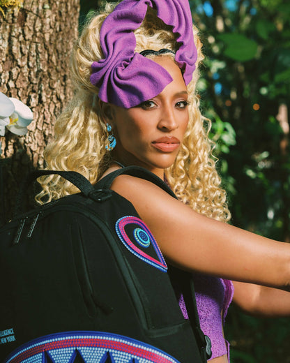 Sprayground - A.I. AFRICAN INTELLIGENCE BORN AND RAISED BACKPACK - SANDFLOWER COLLAB