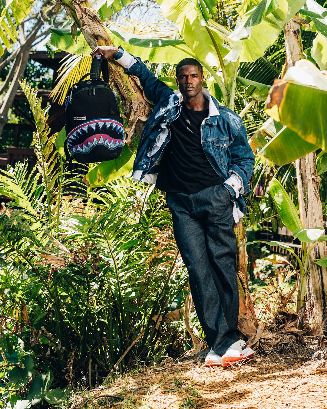 Sprayground - A.I. AFRICAN INTELLIGENCE BORN AND RAISED BACKPACK - SANDFLOWER COLLAB