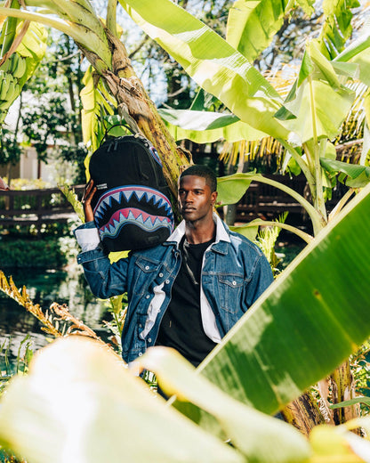 Sprayground - A.I. AFRICAN INTELLIGENCE BORN AND RAISED BACKPACK - SANDFLOWER COLLAB