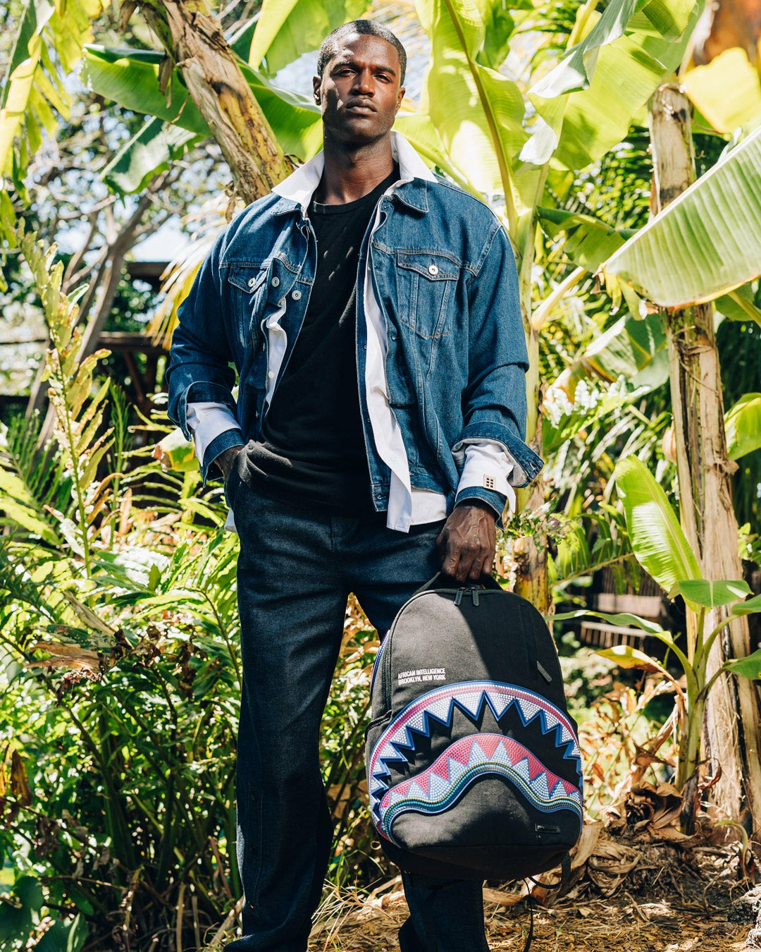 Sprayground - A.I. AFRICAN INTELLIGENCE BORN AND RAISED BACKPACK - SANDFLOWER COLLAB