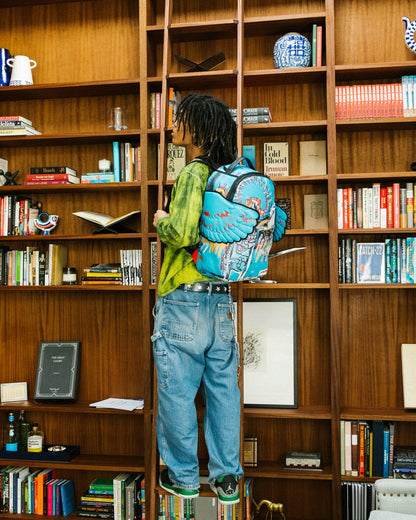 Sprayground - OFFICIAL BASQUIAT UNTITLED (FALLEN ANGEL) 1981 WING BACKPACK (DLXV)
